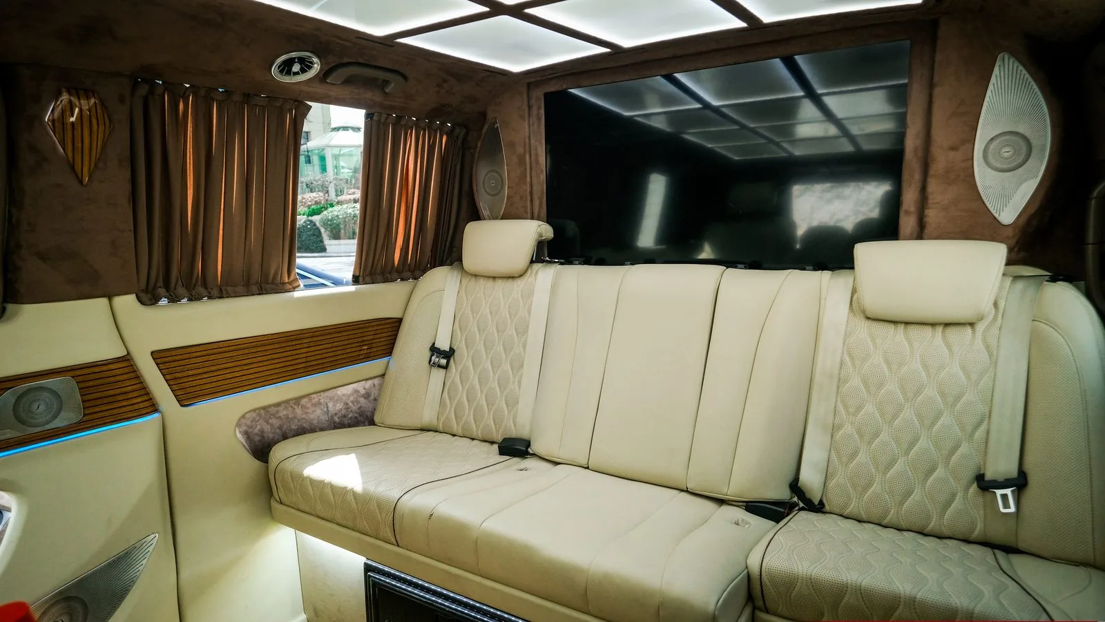 Interior of a chauffeur-driven van with luggage space